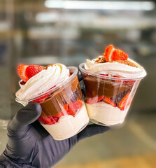 Delicious strawberry mousse dessert in a jar for delivery
