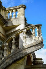 Spiral staircase made from stone on building exterior in traditional style