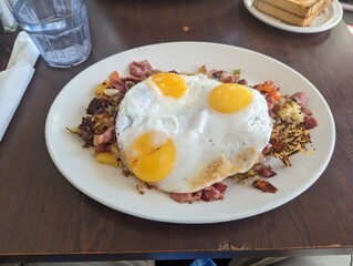 Hash with sunny side up eggs