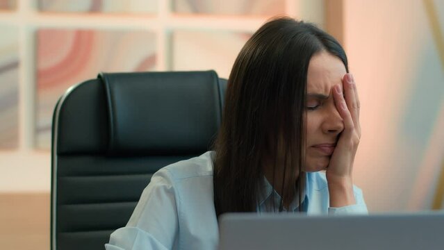 Shocked frustrated sad stressed Caucasian business woman girl female businesswoman employer reading bad news job problem mistake computer error loss money failure stress bankruptcy at office workplace