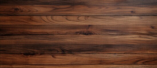 A closeup shot of a brown hardwood plank flooring with a blurred background, showcasing the natural wood grain pattern and beige tones - obrazy, fototapety, plakaty