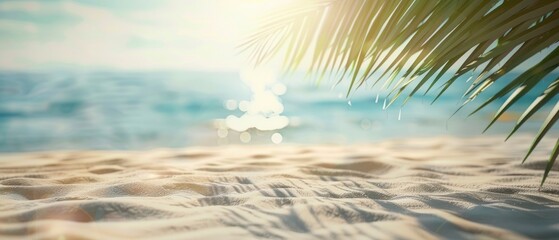 Fototapeta na wymiar Blue water, coconut leaves, glittery sand and a beautiful sunny day at beach.