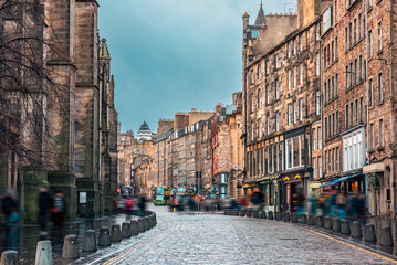 The cobbled street between old buildings along the Royal Mile in Edinburgh Old Town, Scotland