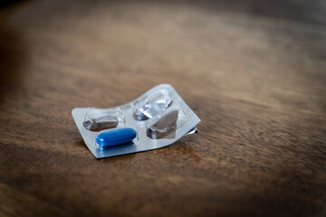 blue medicine pill in a worn container, Mallorca, Balearic Islands, Spain