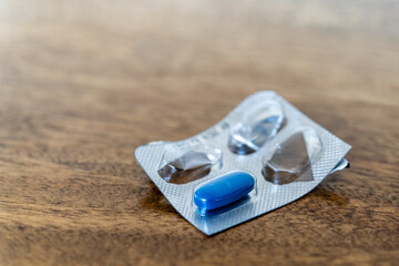 blue medicine pill in a worn container, Mallorca, Balearic Islands, Spain