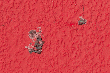 Broken wall hole on the surface of red construction texture object details for reconstruction and repair close-up