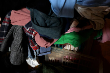 Background photo of piles of dirty clothes in a house