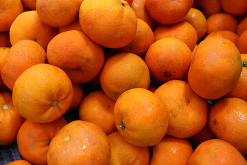 Photo of fresh oranges at the market, this fruit contains a lot of vitamin C