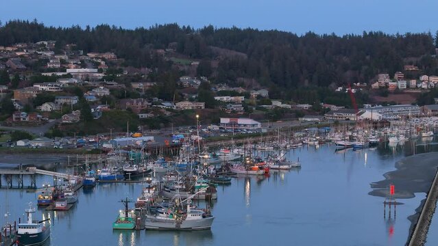 Sunset over Yaquina Bay Newsport Oregon Coast Fishing Boats. Seafood Processing and Tourism.