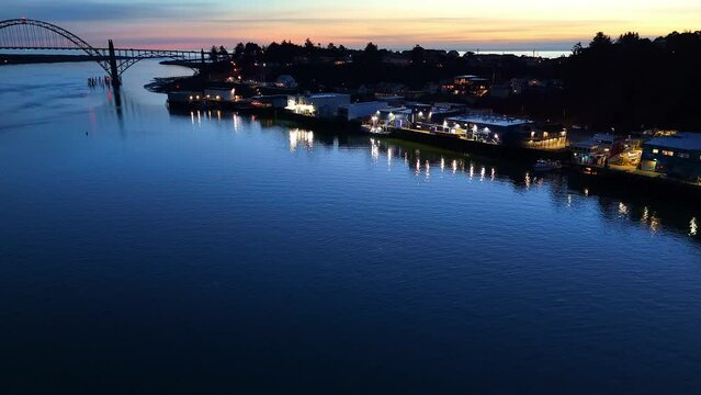 Yaquina Bay Bridge Harbor and Seafood Industry Evening Aerial Footage