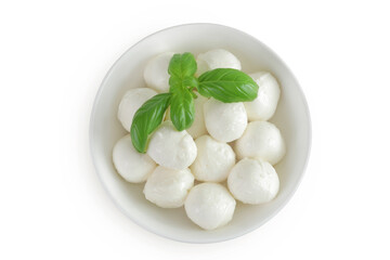 Mini mozzarella balls with basil in a ceramic bowl isolated on white background. Top view. Flat lay.
