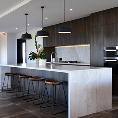 a kitchen with a large floating kitchen island in a matte white finish with matte white stone benchtops. The floor is a dark brown timber and there is a featured splashback tile in a heavily textured 