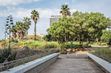 Independence Park in in Tel Aviv city, view with Hilton Hotel, Israel - obrazy, fototapety, plakaty
