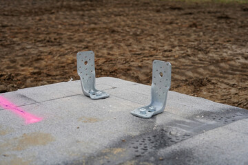 Fixing metal sheets. They are screwed into the base plate.