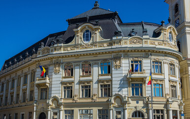 City Hall building and Tower of Jesuit Church of Holy Trinity in Old Town of Sibiu, Romania