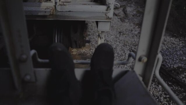 hobo bloggers climbing freight train with cameras