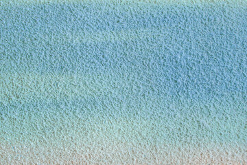 Blue light plaster wall abstract pattern design stucco background texture rough solid coarse structure