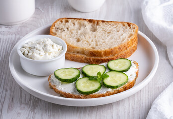 Olive bread with cottage cheese and cucumbers