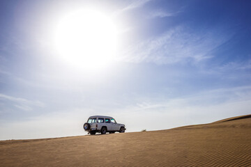 Fototapeta na wymiar 4x4 car for tourists on Maranjab Desert, Iran