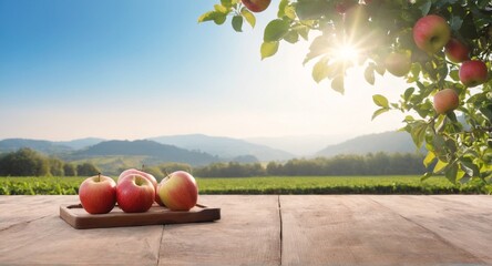 Fresh apples on table, garden background. Autumn harvest - obrazy, fototapety, plakaty