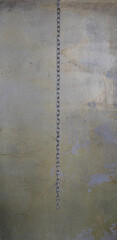 iron chain on a concrete wall - 771785559