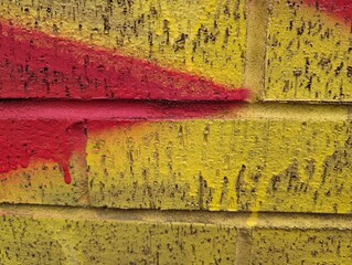 Detail of an urban brick wall with graffiti
