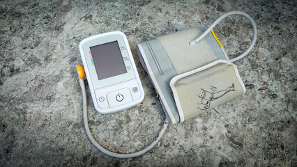A digital sphygmomanometer or tensimeter is a measuring instrument made to measure blood pressure isolated on a ceramic surface