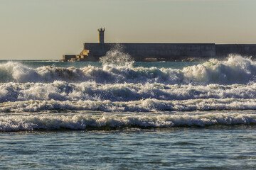 Leixoes Port south breakwater seen from beach in Matosinhos, Portugal