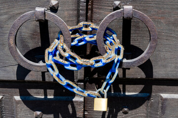 Weathered Iron Rings with Blue Chain and Padlock