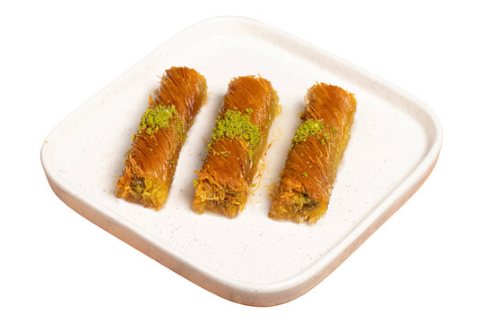 Kadayıf with pistachios isolated on white background. Turkish cuisine delicacies. Ramadan Dessert. local name burma kadayif