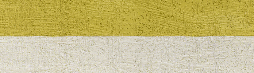 Yellow bright vibrant paint rough wall abstract pattern two colors and white plaster bark beetle texture background design empty blank
