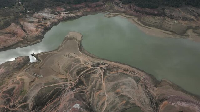 Aerial view of Sau reservoir blue green river Ter shoreline looking down mountain valley. High quality 4k footage