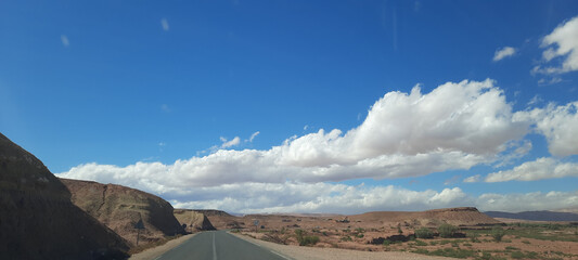 A blue sky with scattered clouds on a beautiful sunny day