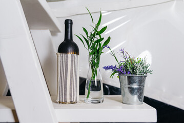 Minimalist Interior with Decorative Plants and Bottle. A simplistic home decor setting with a glass...