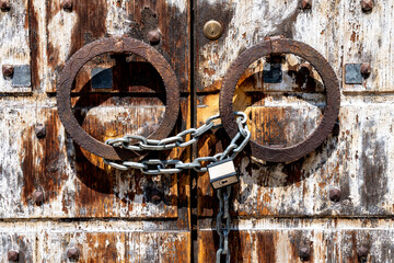 Chained and Padlocked Ancient Wooden Door in Vicenza