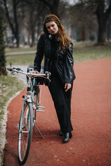 A businesswoman spends time with her bicycle in an urban park, blending work with an outdoor lifestyle.