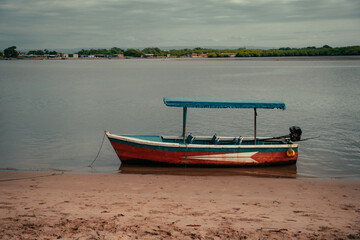 boats on the shore of a river in the Amazon
