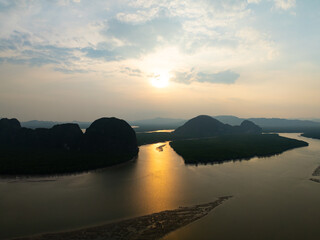 Amazing mountains abundant mangrove forest,Aerial view of forest trees in sunrise or sunset sky over sea