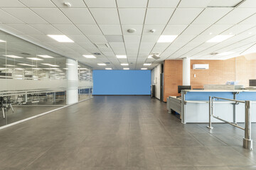 Access area to offices with reception desk and offices in glass fish tanks