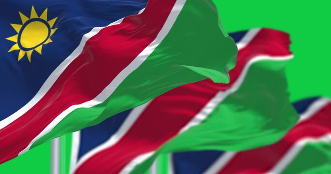 Namibia national flags waving isolated on green background