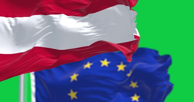 Austria and European Union flags waving isolated on green background