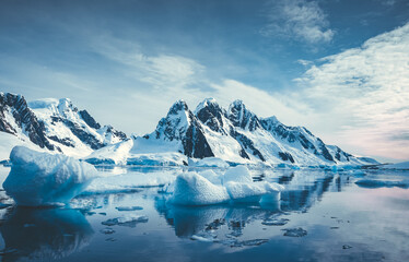 Blue Ice covered mountains in south polar ocean - obrazy, fototapety, plakaty