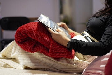 Asian woman reading book in relaxation time at night  in living room