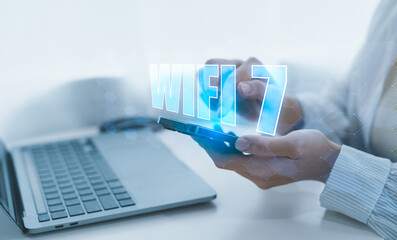 A person holding a holographic globe highlighting Wi-Fi 7 connectivity, Global Wi-Fi Connectivity and Internet Technology Concept.  representing the global reach of modern internet technology. wifi7.