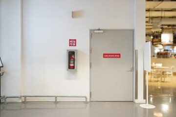 Fire extinguishers and fire escape door within the department store