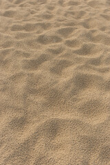 Beach sand abstract pattern footprints after rain nature texture background desert