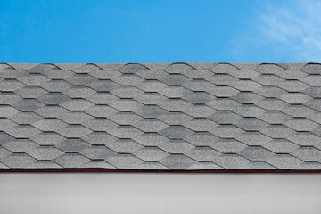 Grey mosaic tile roof house structure abstract building home pattern design object blue sky background