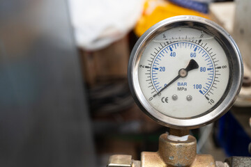 close up of pressure gauge on the machine , engineering equipment concept
