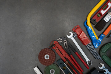 Old tools equipment on black table background, engineering concept