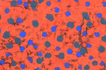 Blue abstract pattern brush strokes on bright orange wall surface texture background
